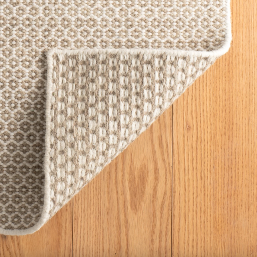 Tapis en laine tissée ivoire/gris en nid d'abeille