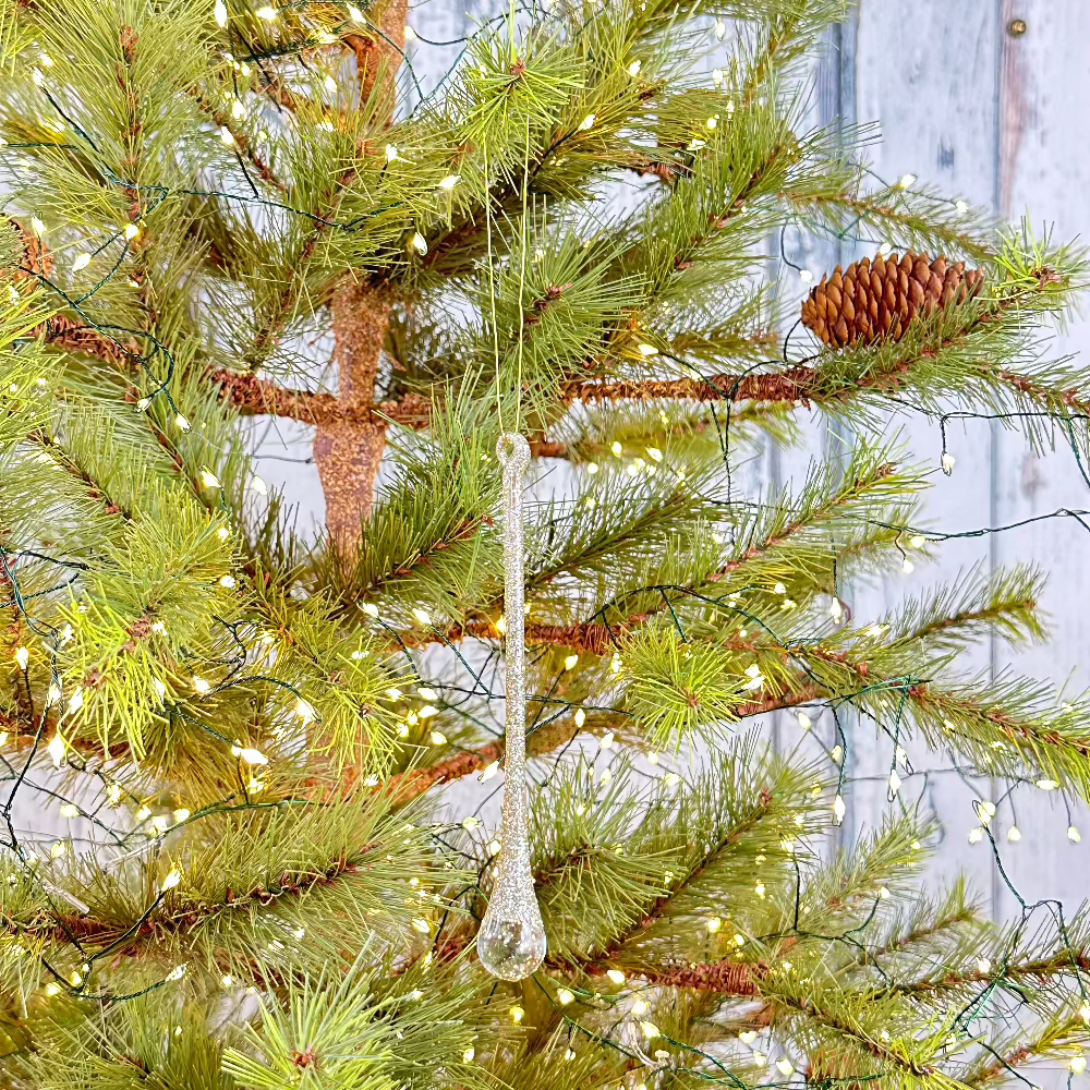 Glass drop ornament with champagne glitter at Home Smith