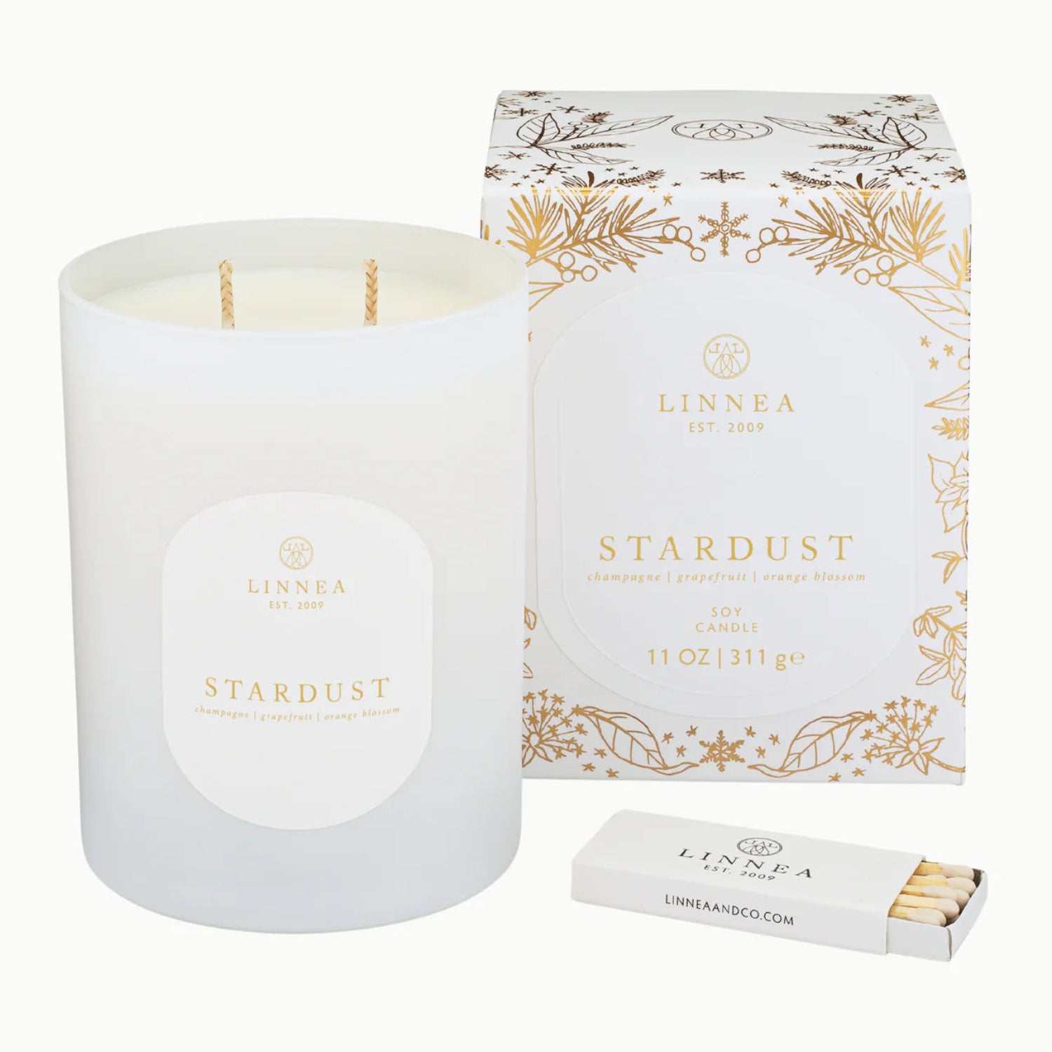 Linnea Stardust candle with packaging and matches on a white background