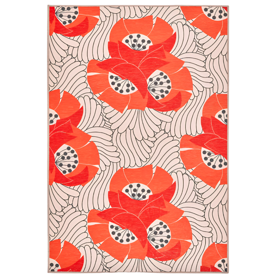 A rectangular rug with a vibrant orange background and a floral pattern consisting of poppy flowers in various shades of red and white.