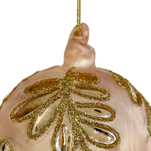 Close up of glass ball ornament with moulded pink silver leaf at Home Smith