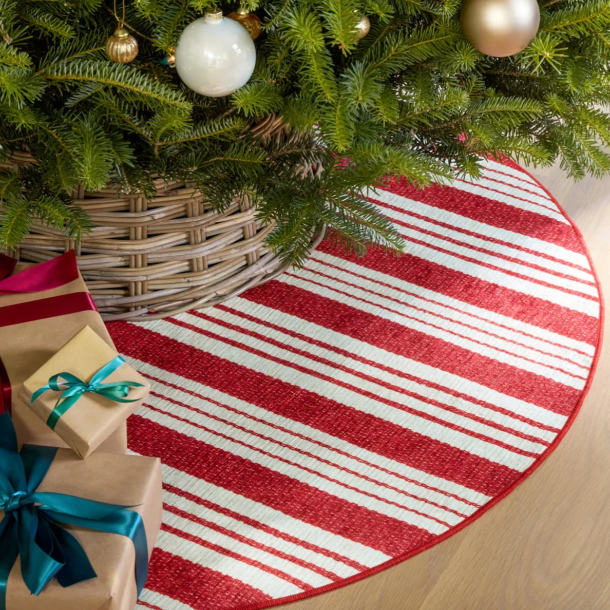 Abby red ticking stripe dash and albert round rug under Christmas Tree at Home Smith