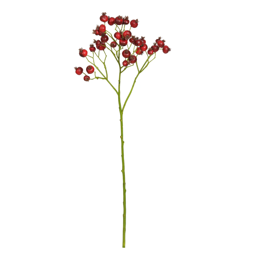 Artificial flower stem with red berries on a white background