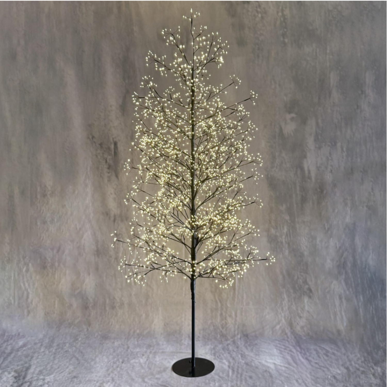 Decorative tree with lights on a textured gray background