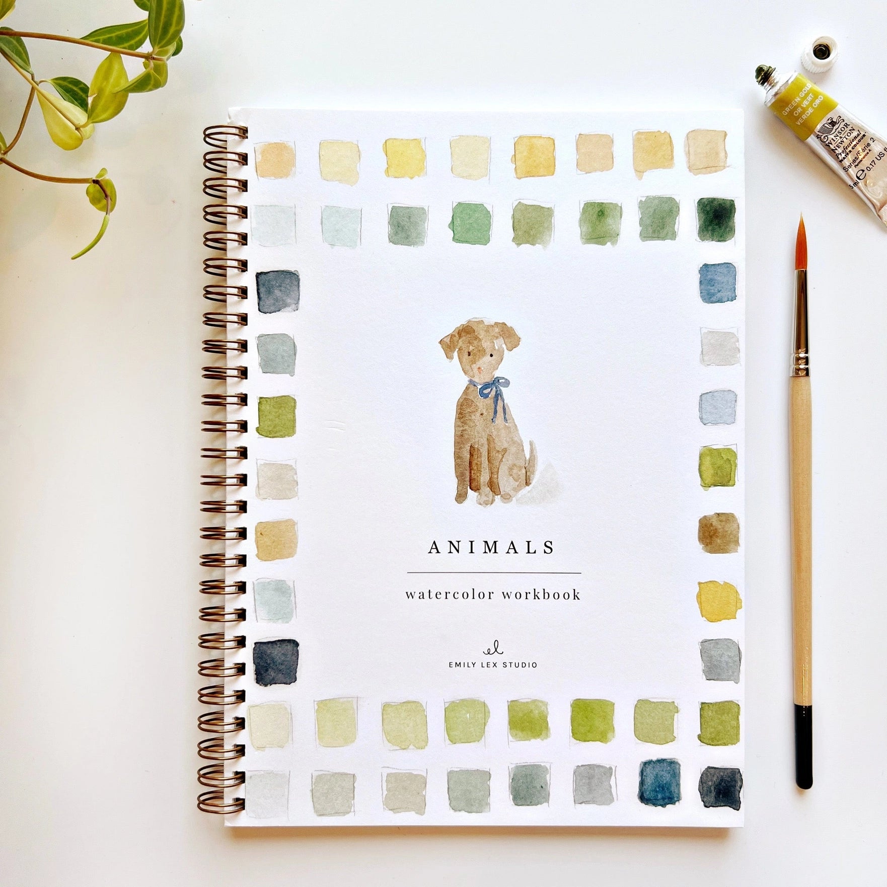 Watercolor workbook titled 'Animals' with a dog illustration on a white background