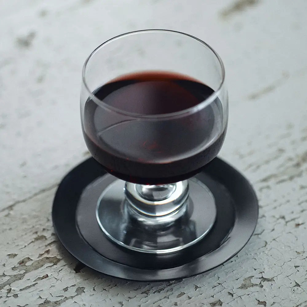 Black metal coaster or candle plate on Home Smith