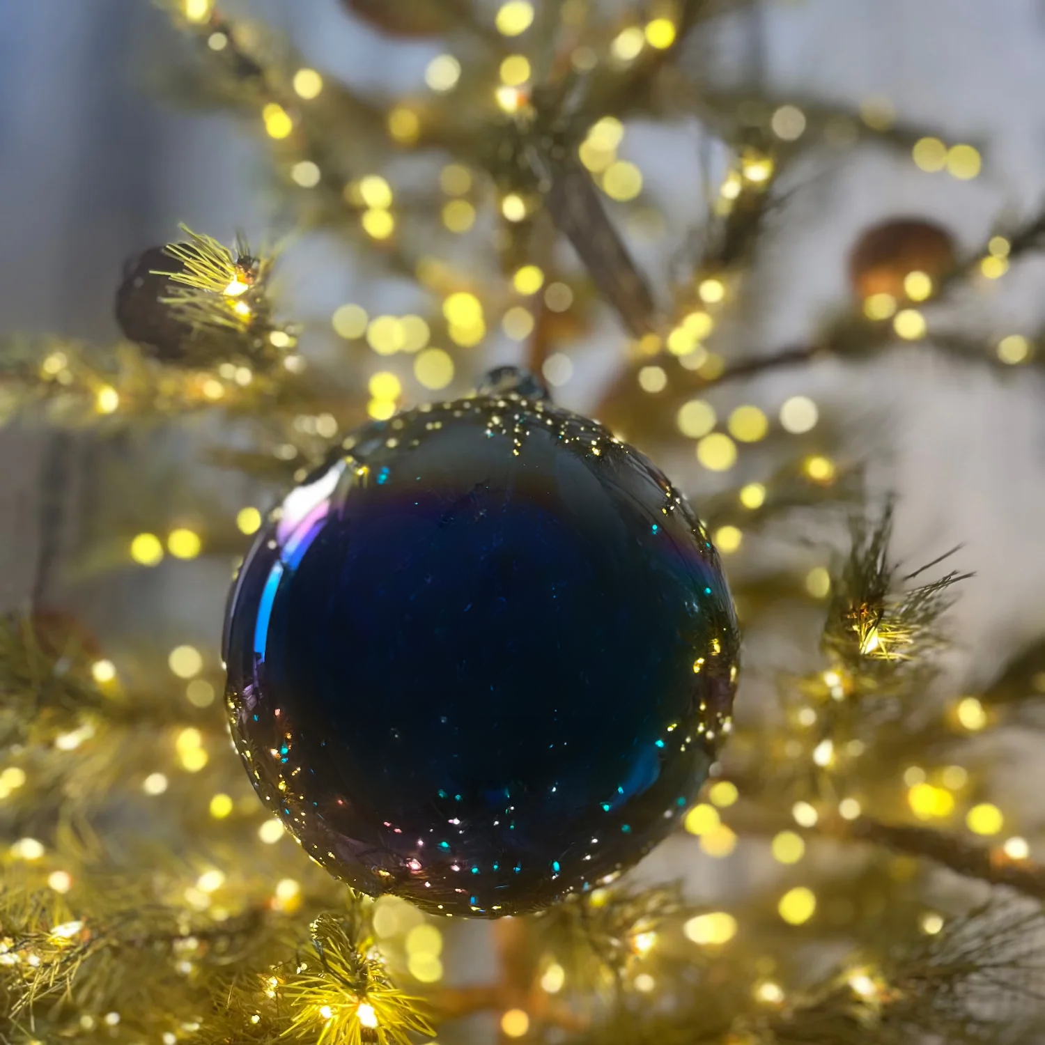 Jim Marvin Handblown Iridescent Bottle Glass Ornament in Dark Blue