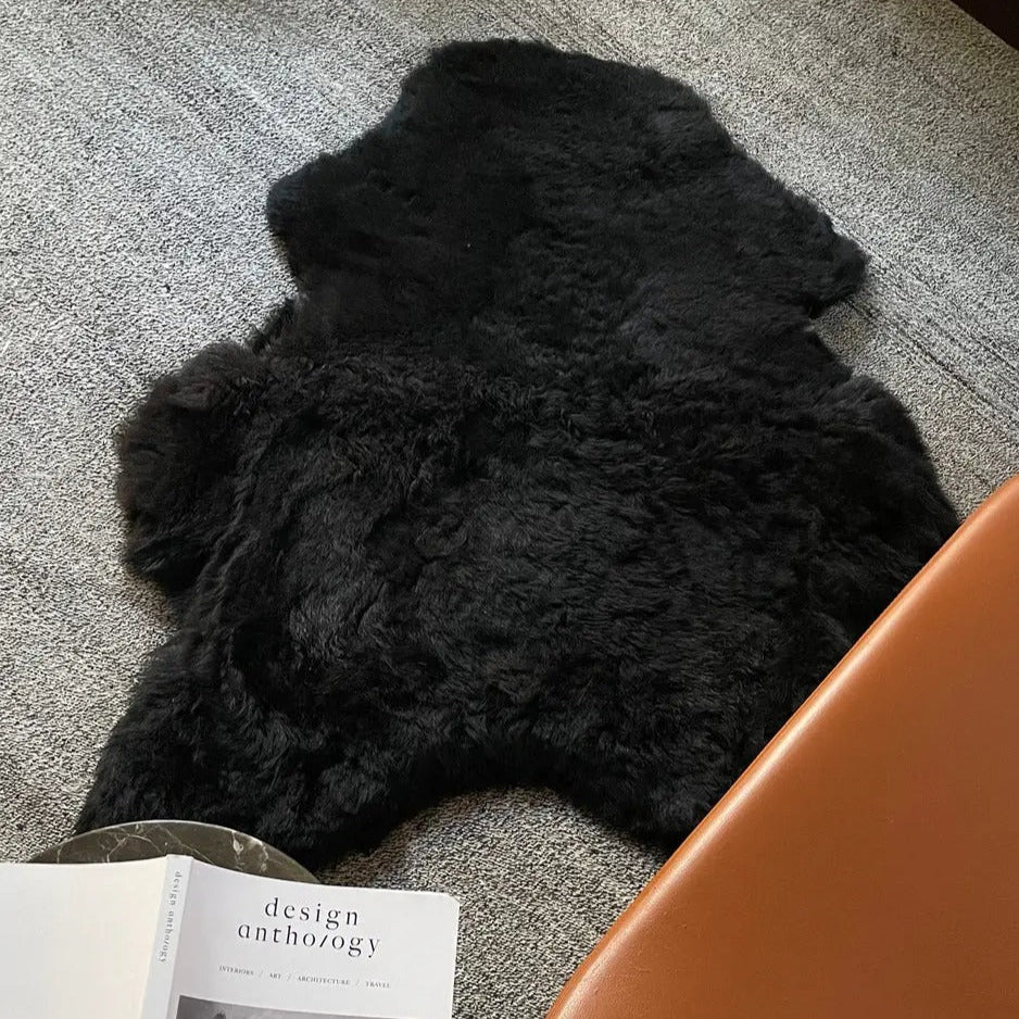 Home Smith Icelandic Sheepskin Throw in Shorn Black Black Sheep White Light Inc. Throws