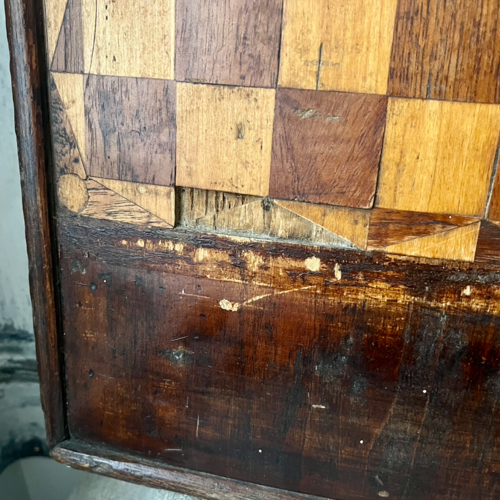 Detail of antique wooden game board at Home Smith