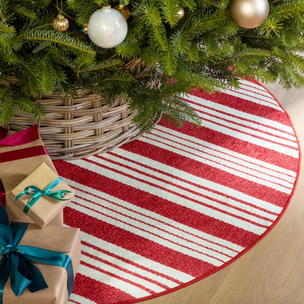 Abby red ticking stripe dash and albert round rug under Christmas Tree at Home Smith 