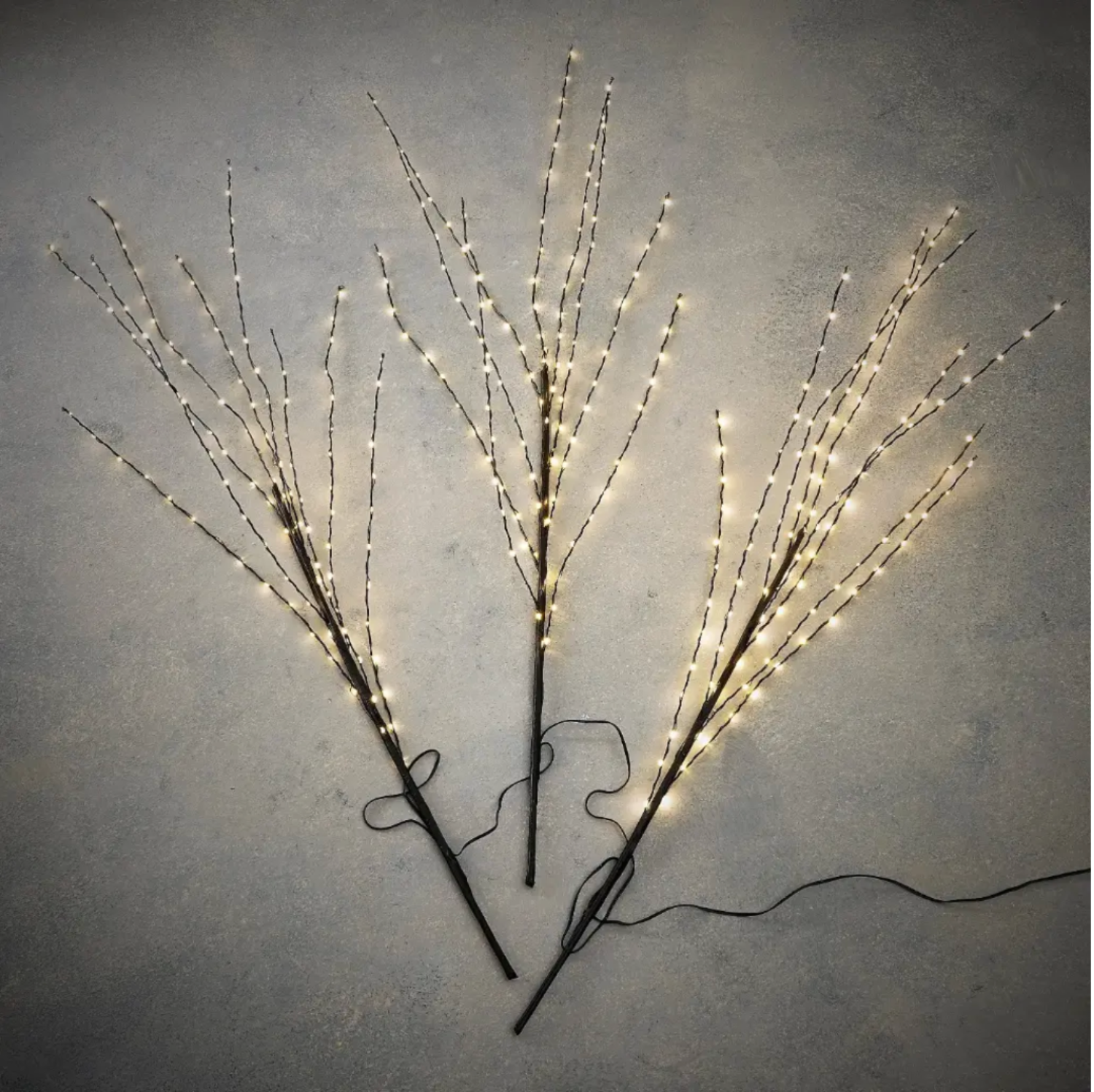 Decorative branches with LED lights on a gray background