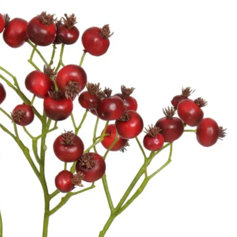 Artificial red berry branch on a white background